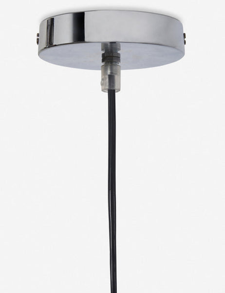 | Close-up of the metallic ceiling fixture on the Paige black plush pendant light with palm tree fibers