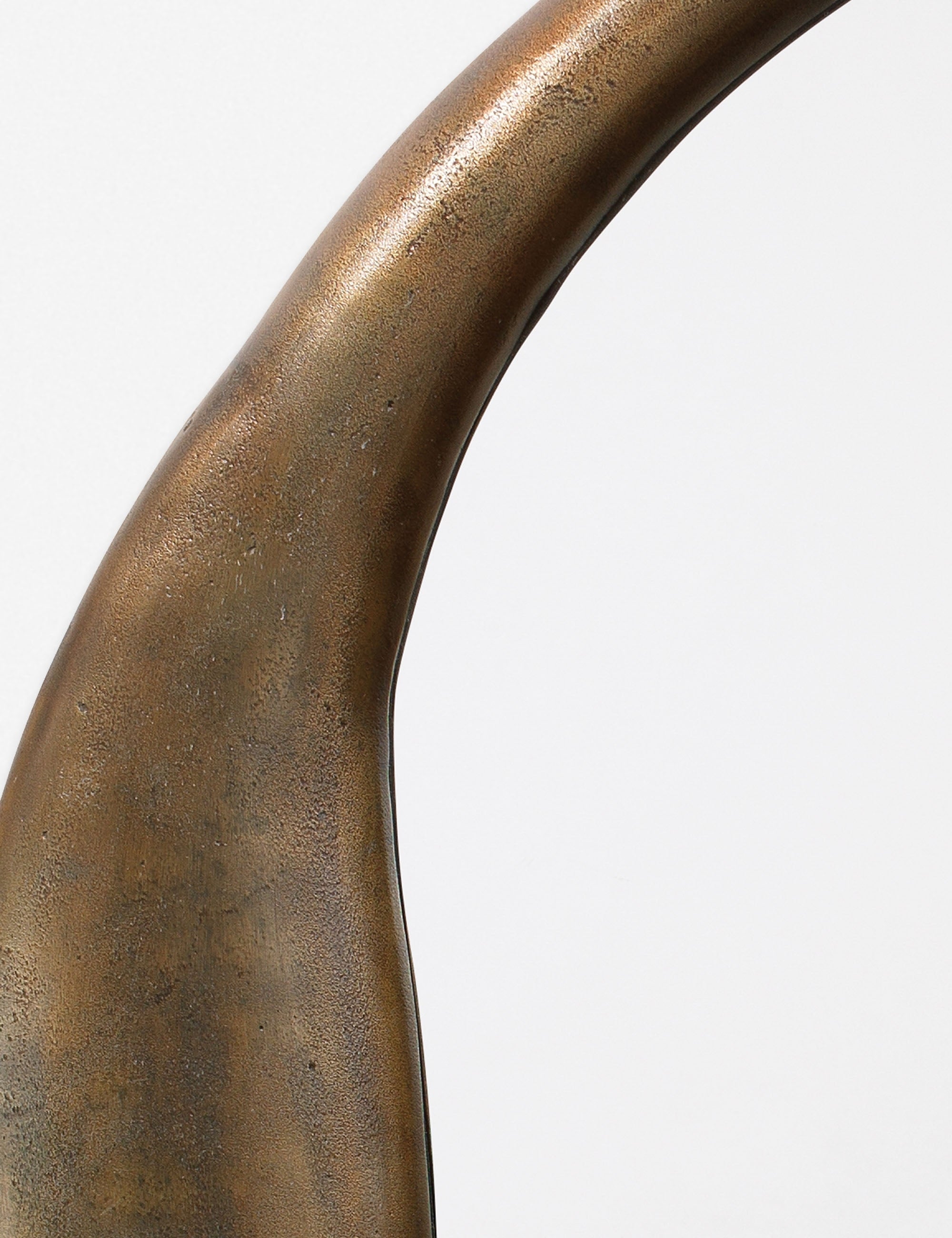 Close-up of the inorganic frame design on the Doreen brass organic round mirror