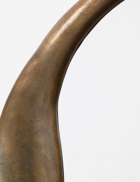 #color::brass | Close-up of the inorganic frame design on the Doreen brass organic round mirror