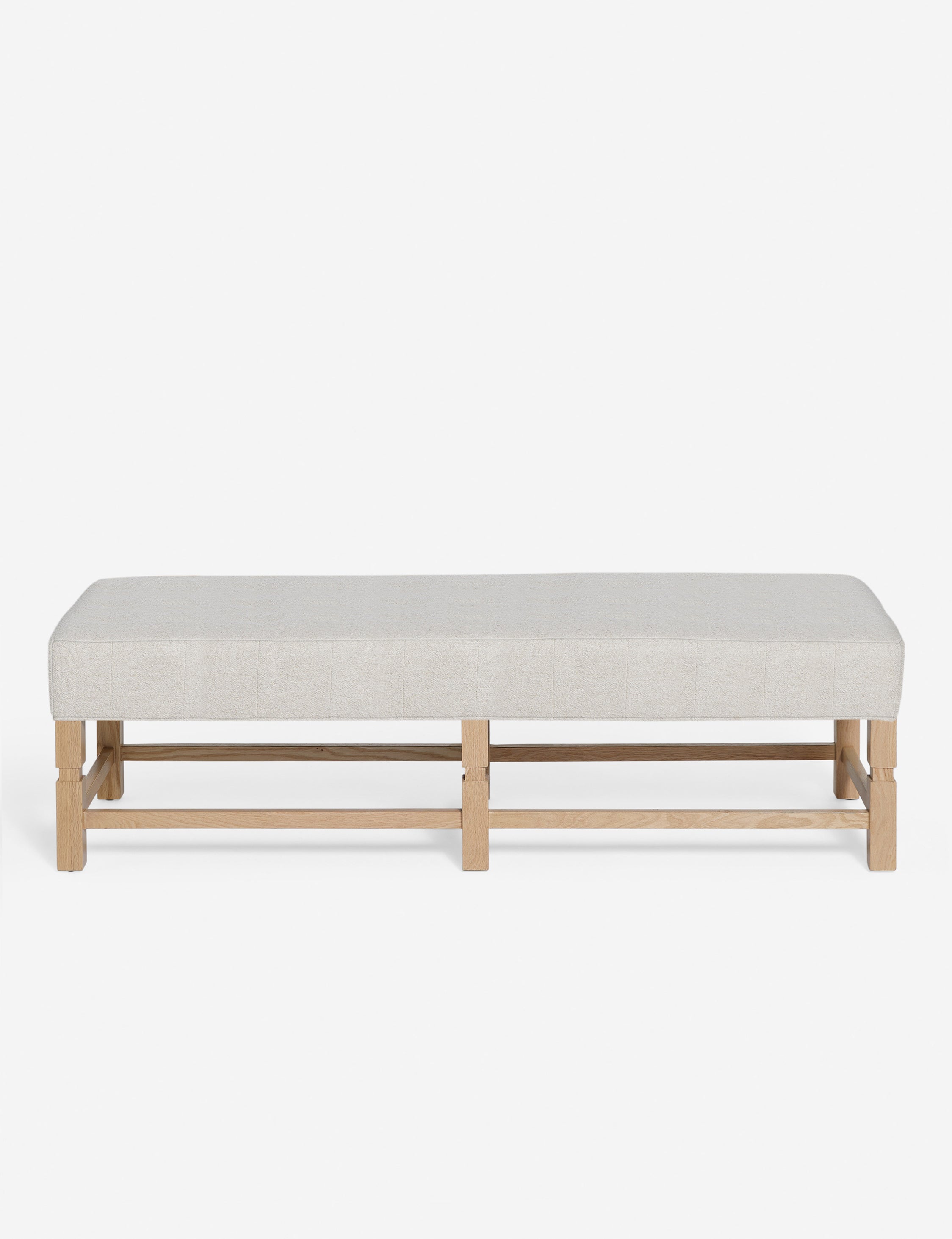 Ambleside Taupe Boucle upholstered bench with carved detailing on the frame and vertical channeling around the cushion by Ginny Macdonald