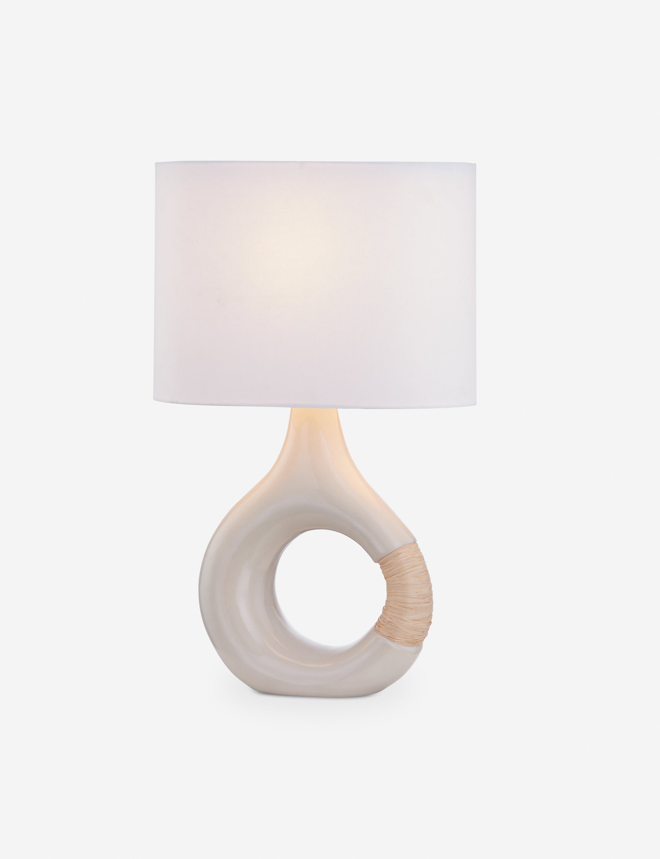 Dano round sculptural mixed-material table lamp.