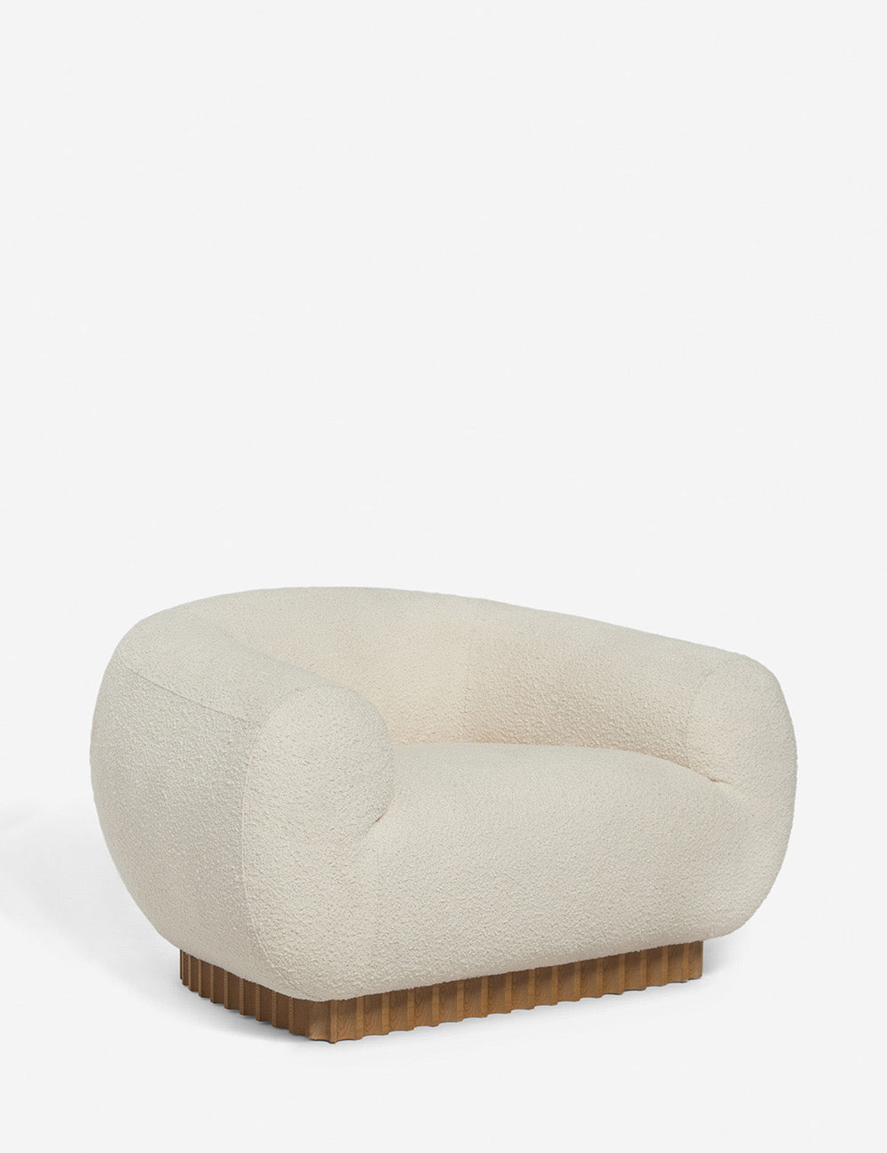 Angled view of the Billow ivory boucle lounge chair