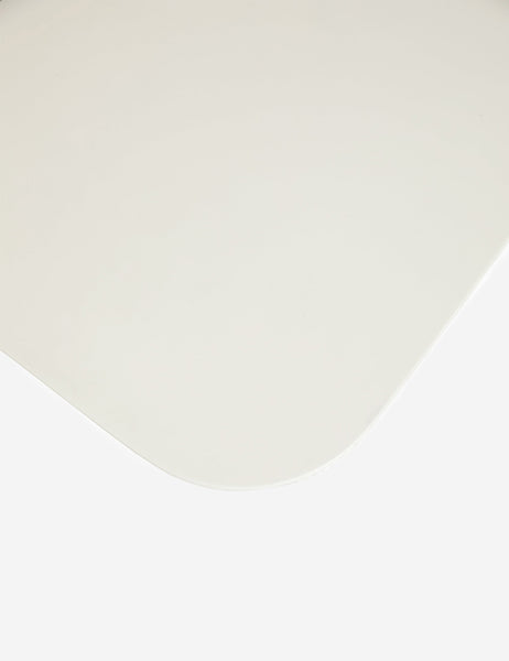 | The rounded corner on the Clouded square white coffee table