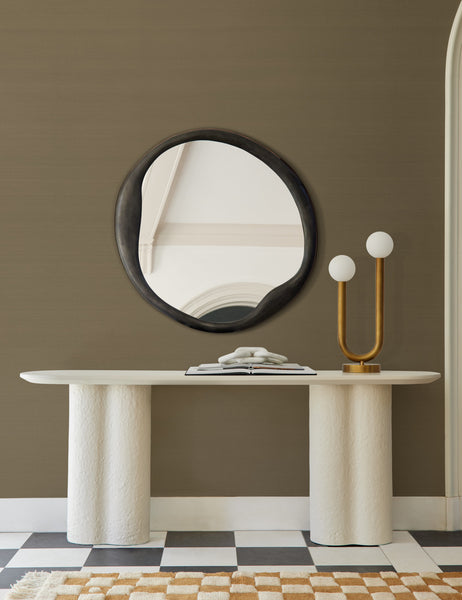 #color::olive | The Grasscloth olive green Solid Wallpaper is in a room with a black round mirror, checkerboard floors, and a white side table