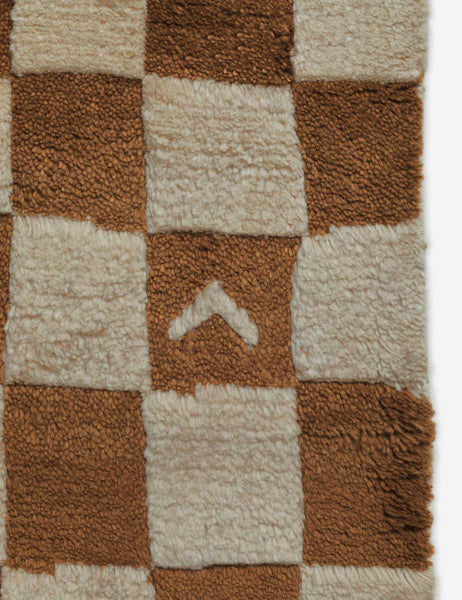 #color::ochre #size::2-6--x-8- #size::6--x-9- #size::8--x-10- #size::9--x-12- #size::10--x-14- #size::12--x-15- | Close-up of the irregular checkerboard pattern on the Irregular ochre checkerboard rug by Sarah Sherman Samuel