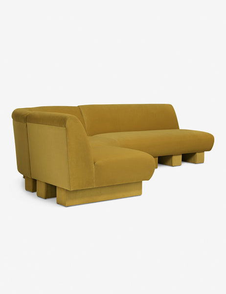 #color::goldenrod-plush-velvet #configuration::left-facing #size::114-W | Angled view of the Lena left-facing yellow velvet sectional sofa with upholstered beam legs.