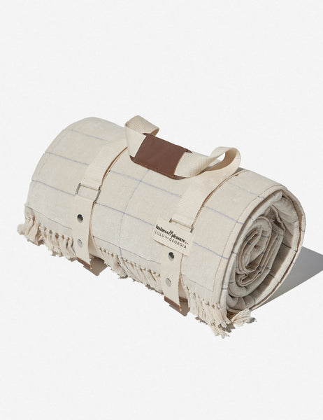 #color::pop-check | The cream popcheck cotton beach blanket by business and pleasure co wrapped up in the leather-handled strap