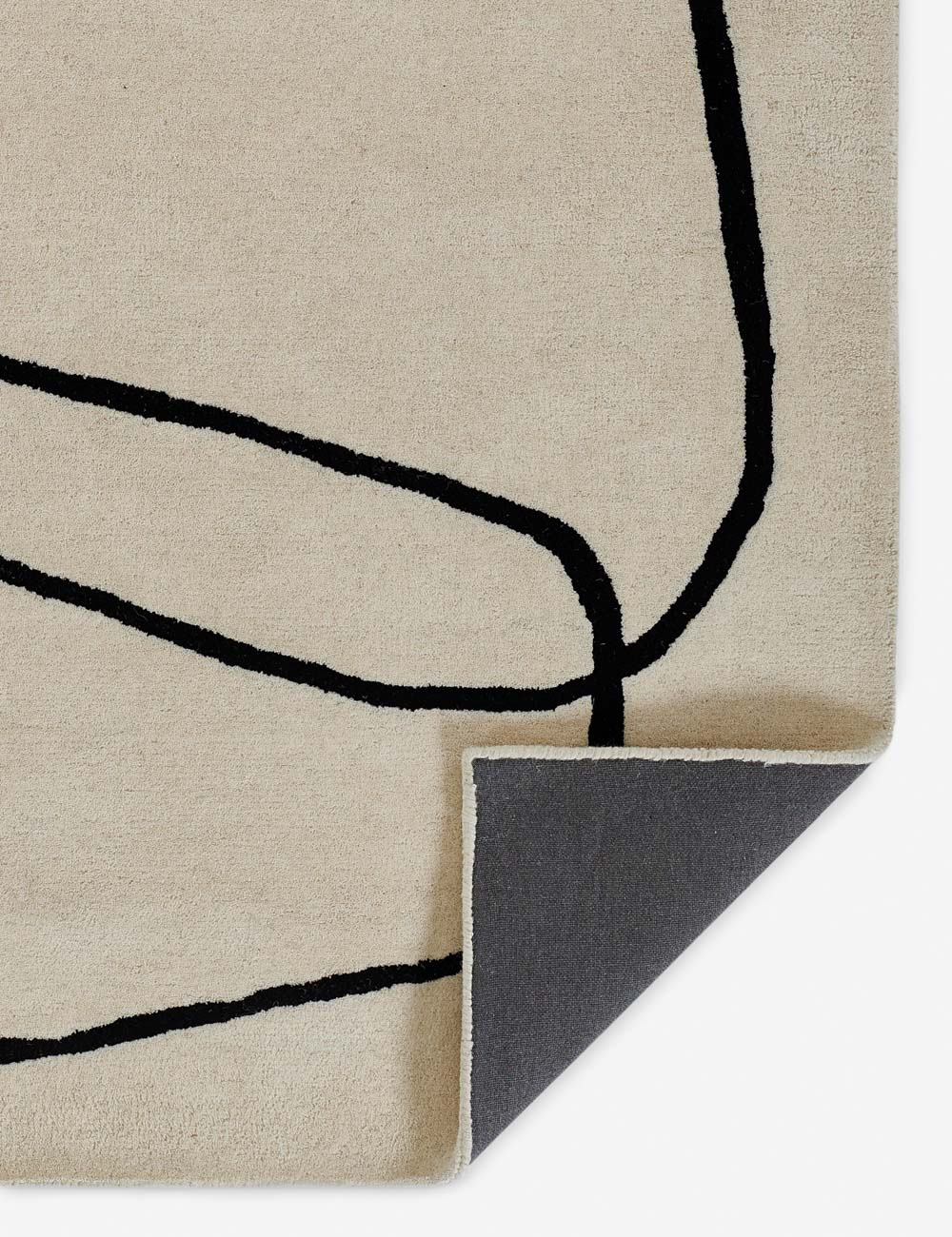 The corner of the Shayla rug folded over