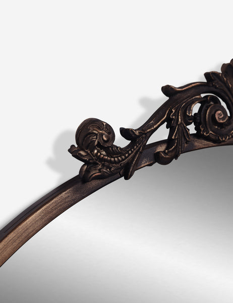 #color::oil-rubbed-bronze | The traditional scroll detailing on the tulca oil rubbed bronze round mirror