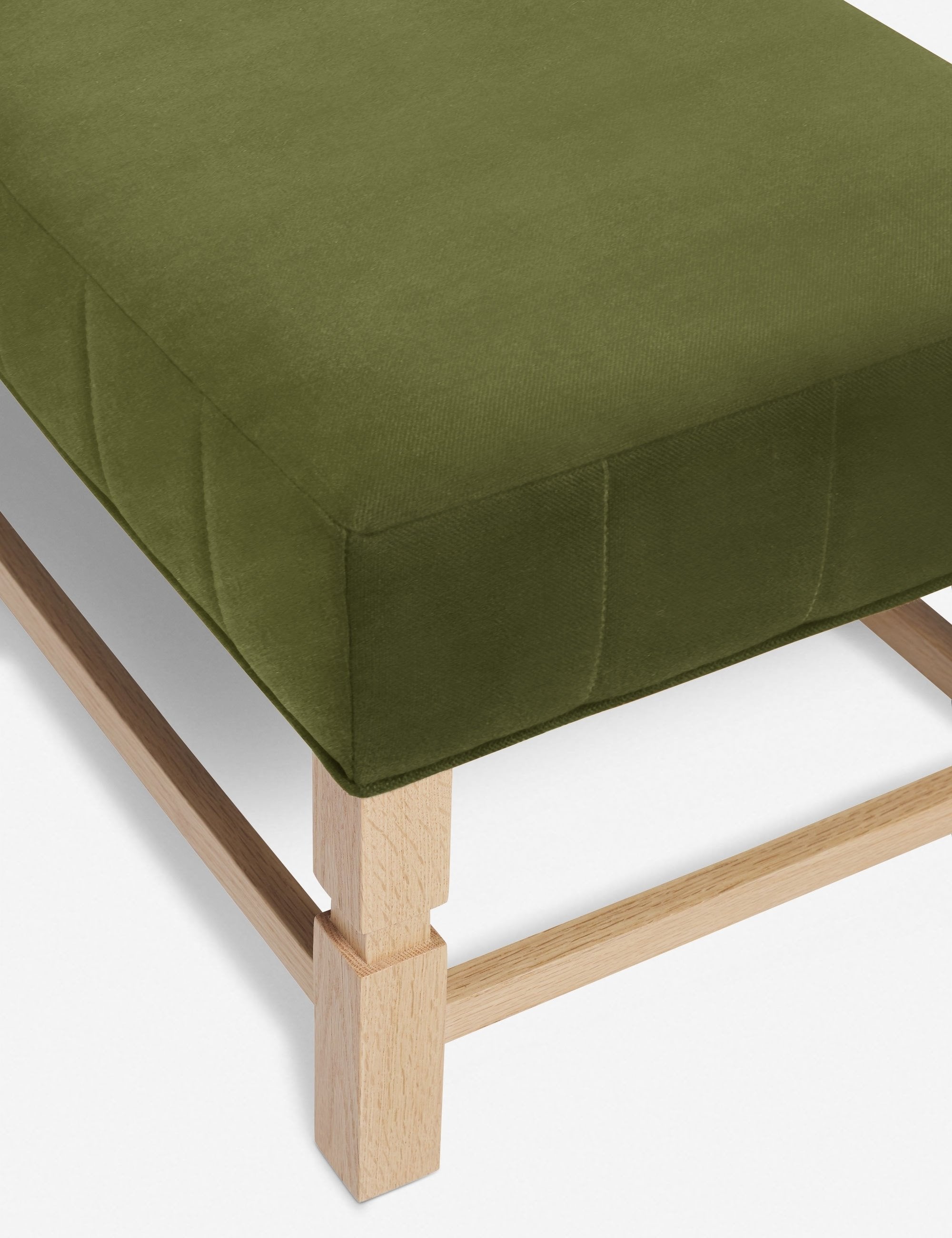 The vertical channeling on the cushion of the Ambleside Jade green velvet bench