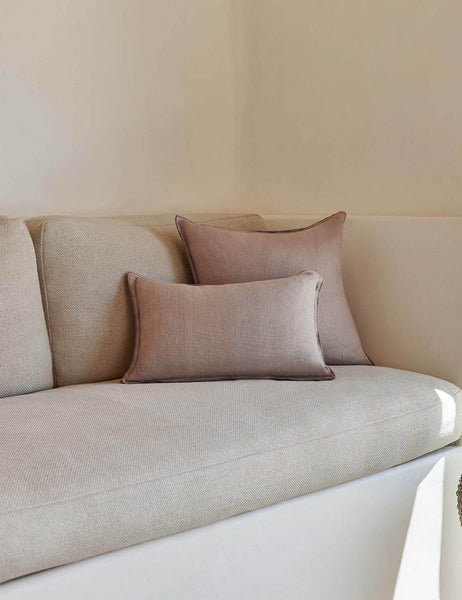 #color::dark-natural #style::lumbar #fill type::with-feather-down-insert #fill type::pillow-cover-only | The arlo Dark Natural flax linen pillow in its lumber and square sizes sit together on a natural linen sofa