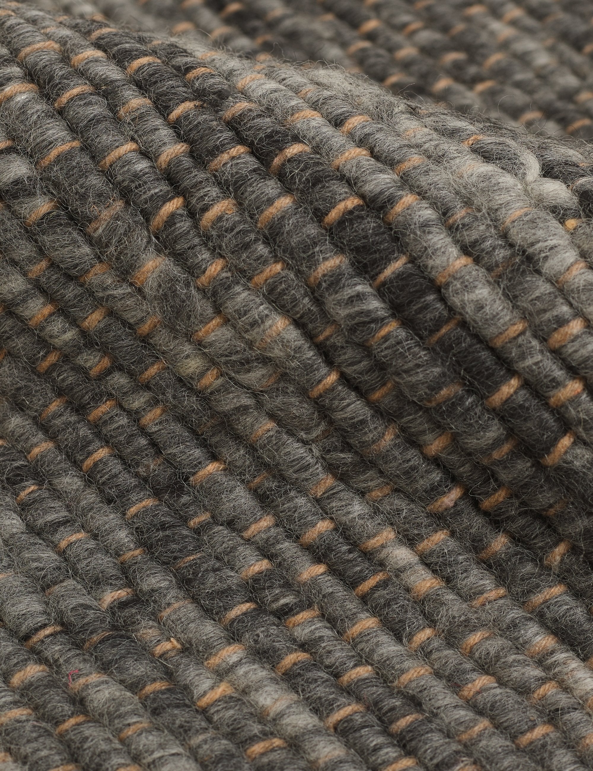 The handwoven all-natural fiber jute construction of the Khloe charcoal rug