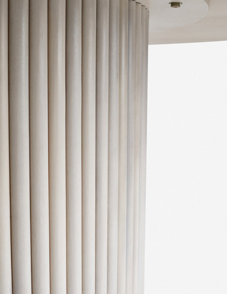 #color::white-wash | Close-up of the textured paneling of the white-washed acacia wood on the pedestal base of the Rutherford round dining table.