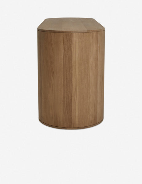 | Side view of the Kono 6-drawer curved oak wide dresser.