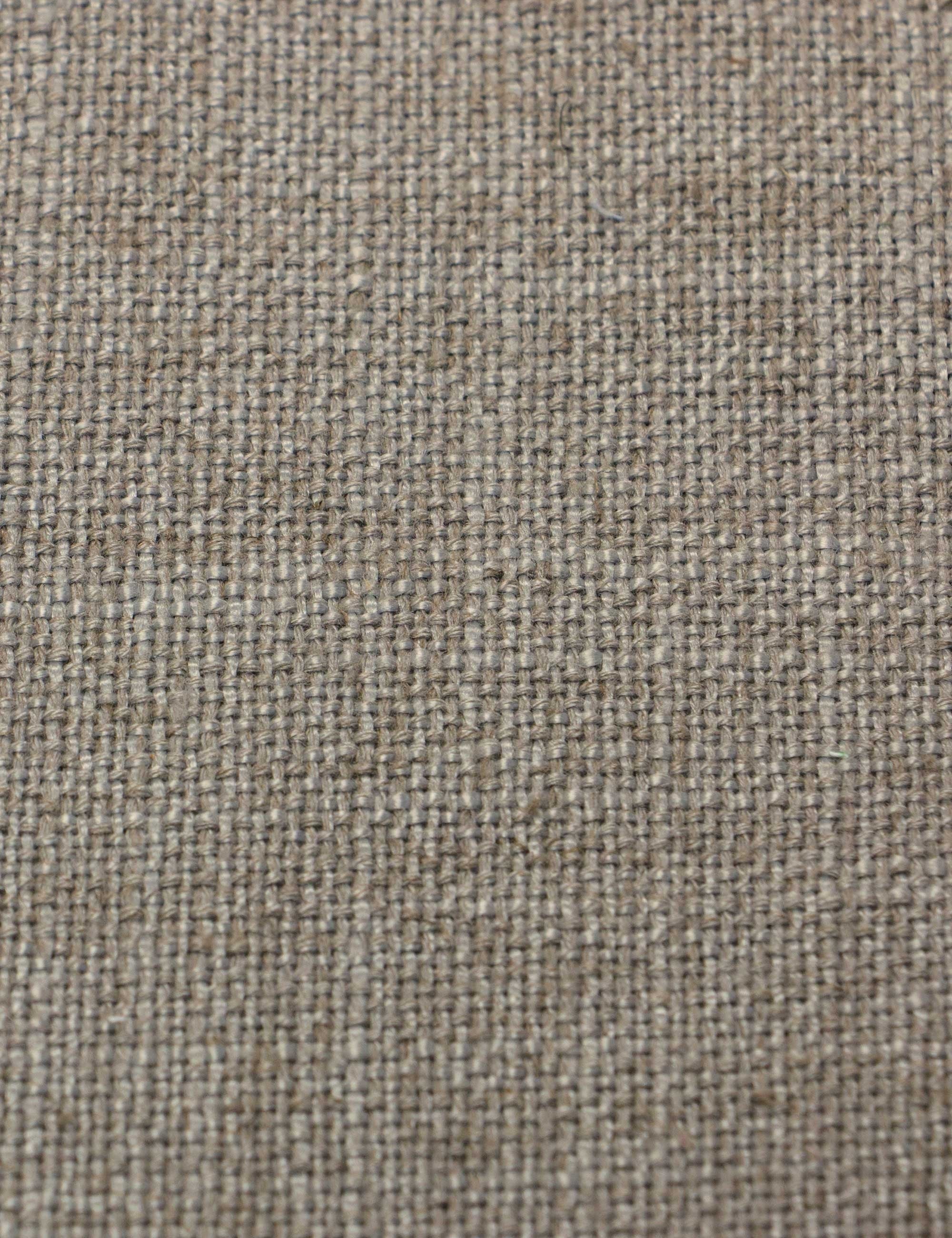 Detailed shot of the navy linen on the Adara light gray linen upholstered bed.
